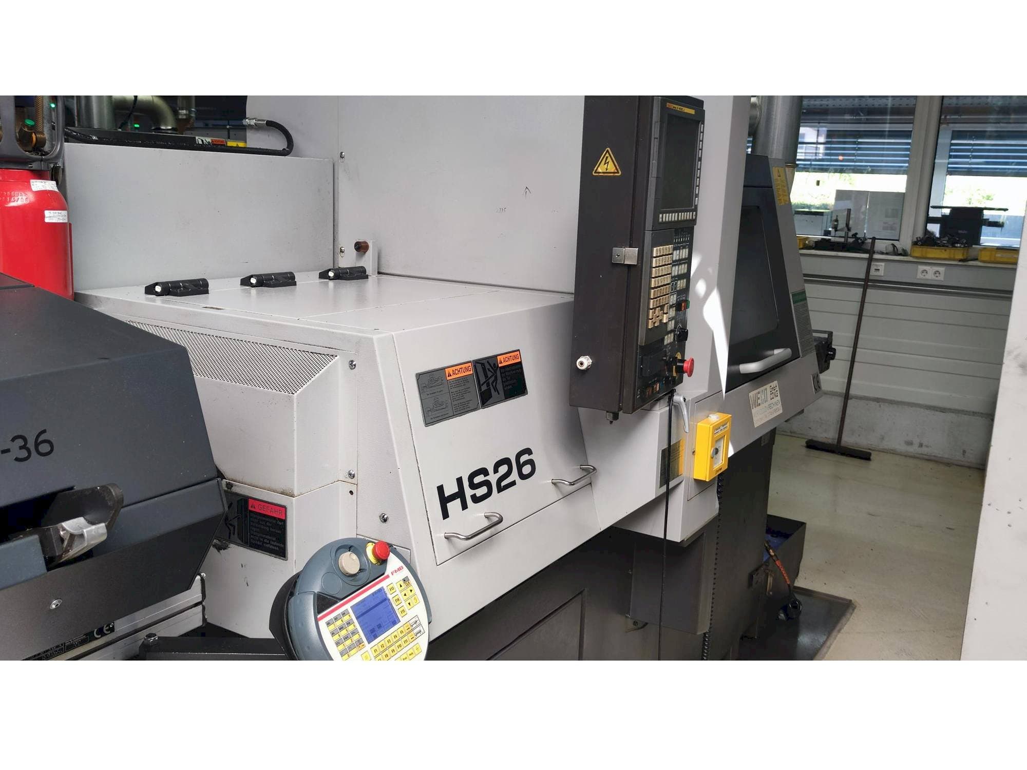 TSUGAMI HS26-maskinen sedd från vänster sida