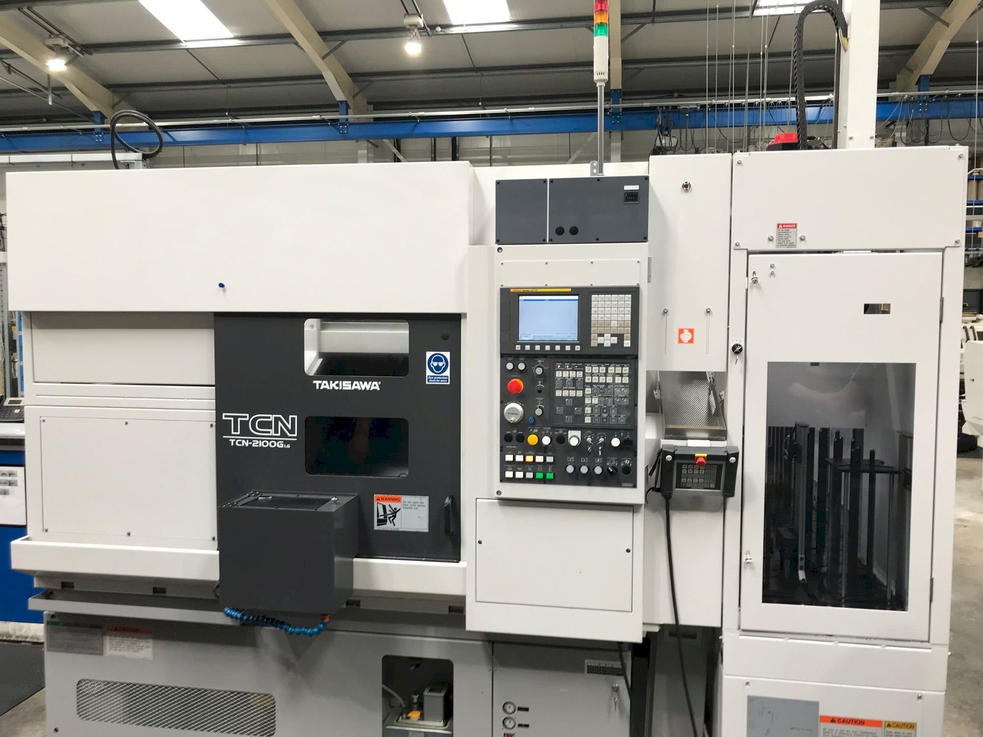 Takisawa TCN-2100G L6-maskinen framifrån