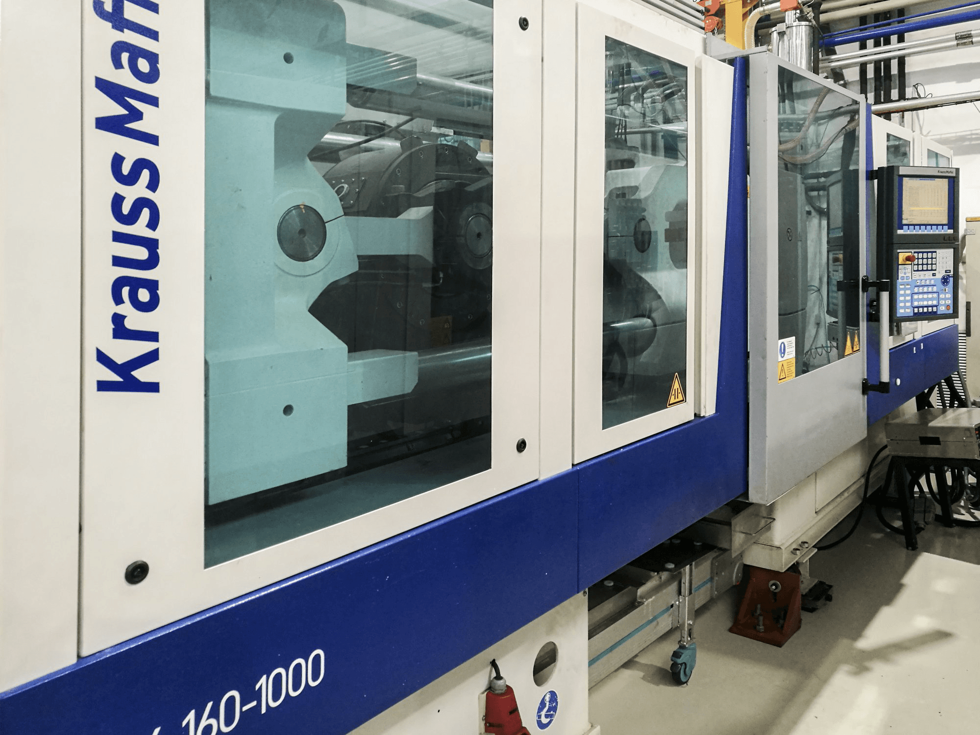 Krauss Maffei-maskinen sedd från vänster160-1000 EX